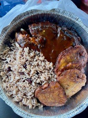 Jerk chicken with rice, peas, and plantains