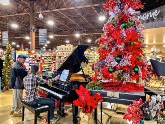 Grandpa talking with the in-store pianist at the grocery market.