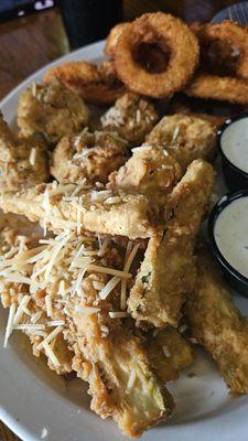 Appetizer sampler with (top to bottom) onion rings, fried mushrooms, and fried zucchini.