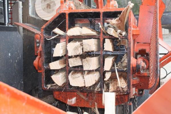 Some firewood getting split before it goes into the tumbler to get rid of the small splinters.