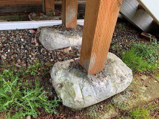 Concrete mix bag used as a pier pad for a deck.