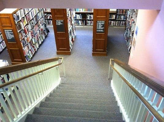 Stairs down to adult nonfiction and teen sections