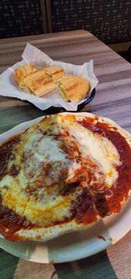 Tuesday special Lasagna with lots of garlic bread $10.99, normal menu price $13.99