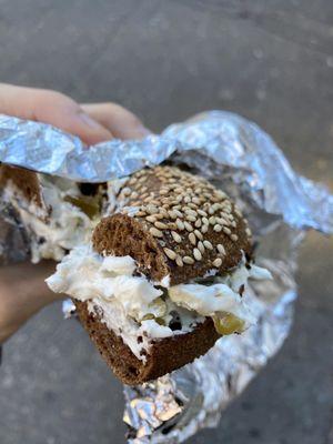 Black Russian (pumpernickel and sesame seeds) bagel with jalapeño cream cheese