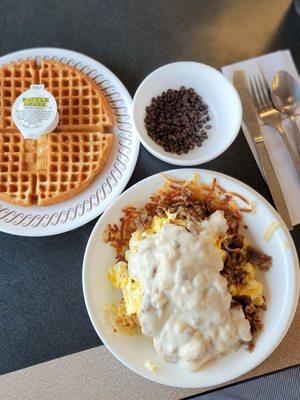 Sausage Egg and Cheese Hashbrown Bowl with gravy and a side waffle with chocolate chips