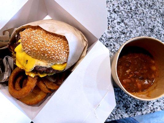 burger with onion rings and baked beans - cross-eyed cricket (delivered by doordash) - bend