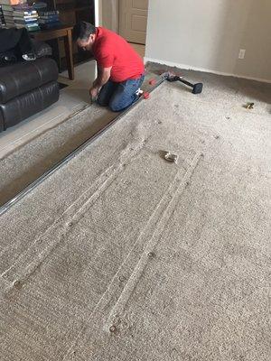 Re-stretching the living room carpet