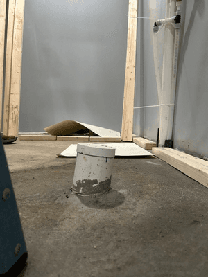 Tilted sewage pipe (under toilet)