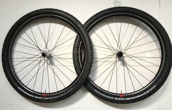 Freshly laced 1300g race wheelset.  Light Carbon, CXray's, DT Swiss 350's.  Zoom!