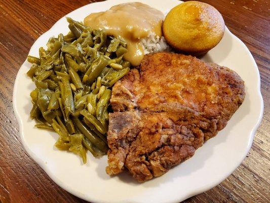 Pork chop plate, green beans, rice & gravy, corn muffin