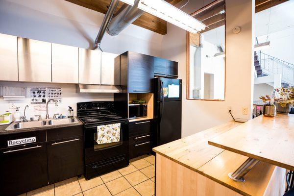 Full-sized kitchen fully stocked with dishes, pots, pans, platter, and so much more.