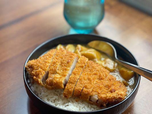 A simple yet perfect lunch.  Katsu Curry Don. Fried pork, rice, curry, potatoes, and carrots.