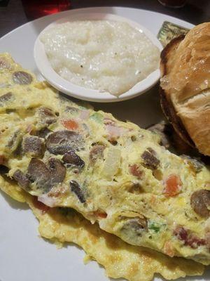 Omelet grits and croissant