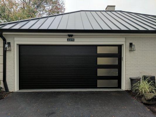 black modern grooved vertical long obscured windows