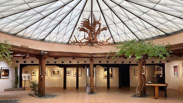 Our gallery features a spectacular round atrium skylight. A great place for hosting gatherings in an art gallery setting.