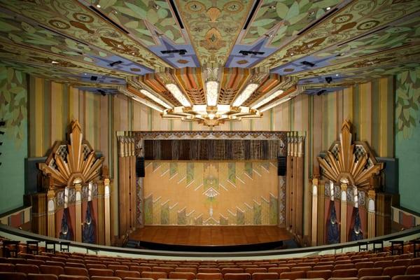 View of the stage from the balcony.  The fire curtain (shown) is original to the 1931 theater building.