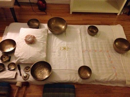 Traditional Tibetan Bowl Layout for Sound Healing Treatments. Floor Mat sessions are available.