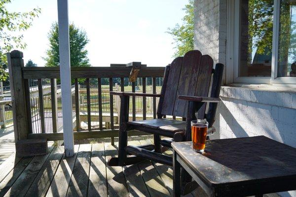 Porch sippin' fresh brewed beer at Michigan Brewing Works at Twopenny Farm.