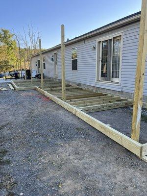 Time to add a deck to go with that concrete patio!