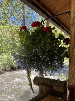 Outdoor seating with flowers and view of the Wind River