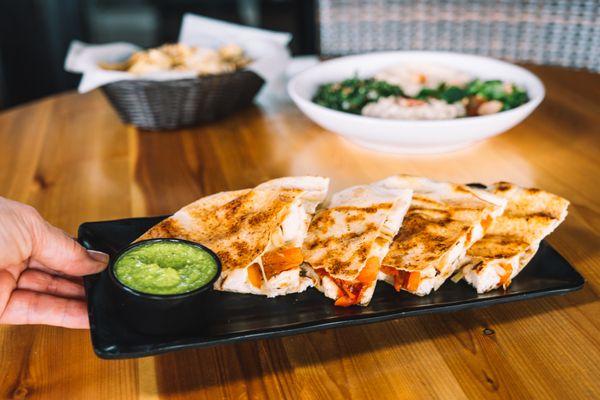 Chicken Pita Quesadilla - Chicken, peppers, onions, mozzarella, provolone, between pita bread, grilled crispy. (soy-free, halal)