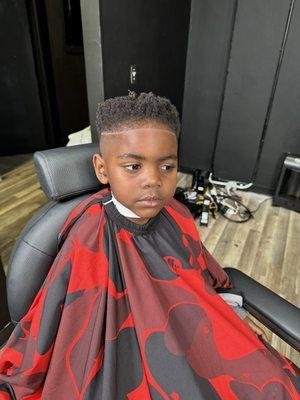 Mid Fade with Afro top. Sharp Line Up with Clean Part on Side.