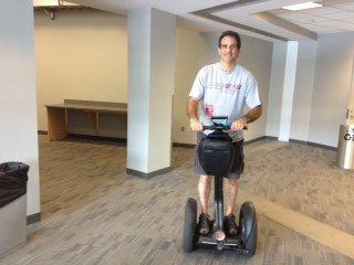 Dr. Charschan riding on Kenny Chesley's Segway when he was working back stage at Metlife center helping crew at the concert.