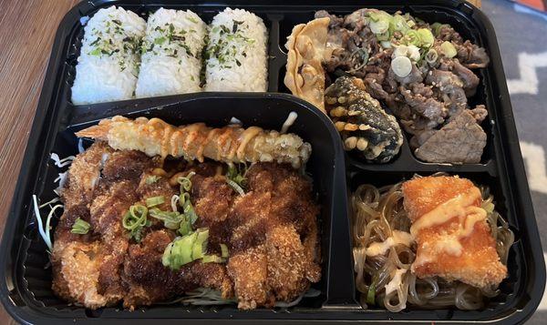 DosiRock Platter Chicken katsu, shrimp katsu stick, shrimp tempura, bulgogi, chicken dumpling, seaweed roll, japchae noodles, seasoned rice