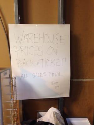 Another sign on the wall of the "warehouse room"