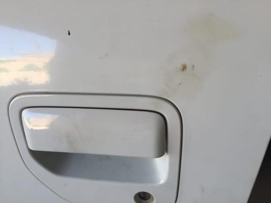 Grease and oil around door handle