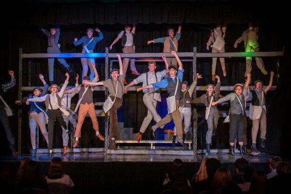 "Newsies" is just one of the spectacular musicals our Theatrical Arts department has presented over the years.