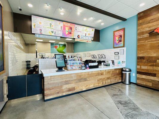 Counter with self-service kiosk on the left