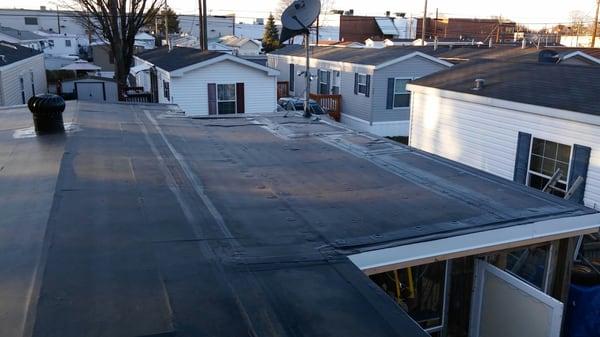 Welch Roofing installing a rubber roof on our mobile  in East Hartford ct