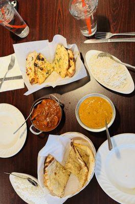 Left: Chicken Vindaloo, Right: Chicken Tikka Masala, Top: Garlic Naan, Bottom: Keema Naan