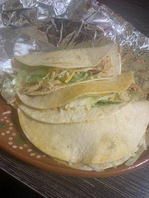 Three soft chicken tacos