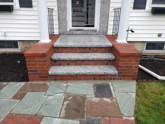 New red brick stairs with salt and pepper color granite just fitted on gay st in Norwood Ma