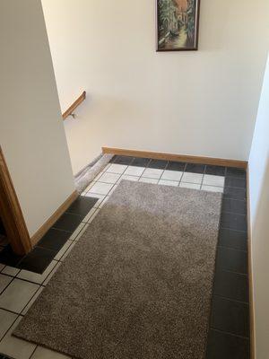 Area rug custom bound from the leftover stairway carpet.