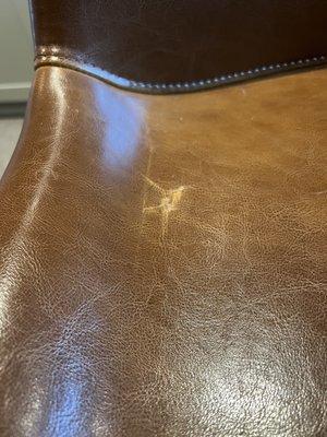 Scratch on leather bar stool