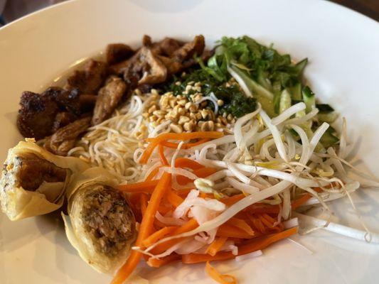 Vietnamese noodles with egg rolls and grilled pork