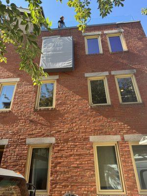 Mattress dropped from roof deck when it would not fit down the newly modified stairs.