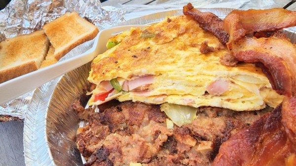 Breakfast Plate: Crispy Hashbrowns, Denver Omelette, bacon, side of Corned Beef hash, and toast. $10... fuget-abboudit!!