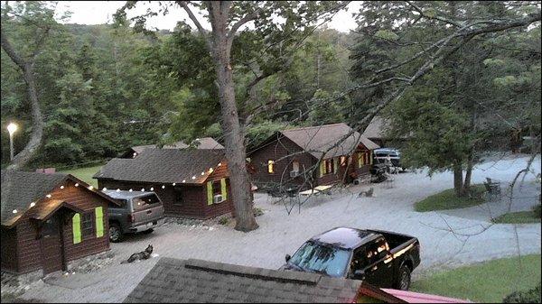 A tree top view of cabins 5, 6, and 7 at sunset.