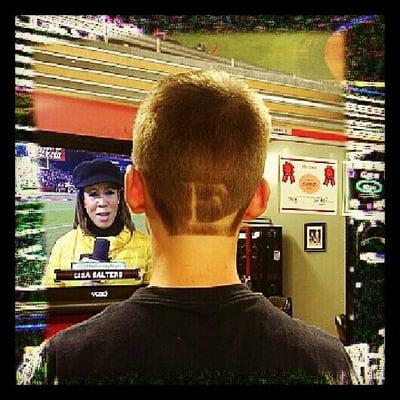 Showing team support, Erika put the Eastlake High School 'E' on the back of this kids head!