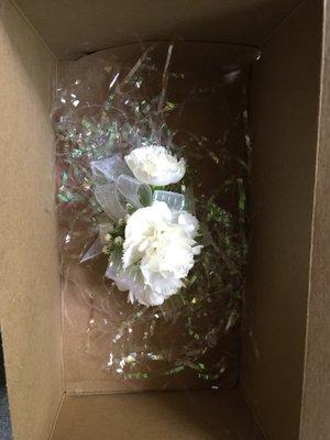 $28 Corsage in a cardboard box.