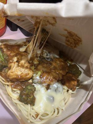 Chicken and pasta meal in a collapsed box with everything stuck to the top