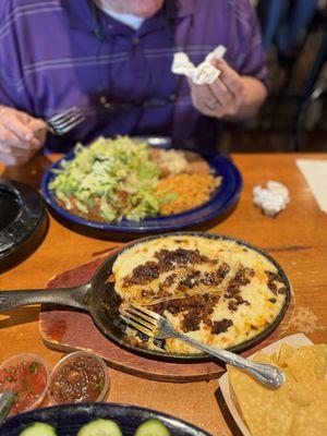 Sopes with chile verde-far dish, and queso fundito