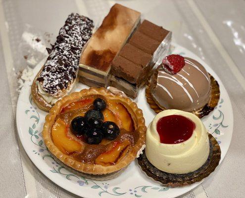 sunflower peach blueberry tart, white chocolate raspberry cheesecake, brasilia, royal chocolate, chocolate trio, vanilla eclair