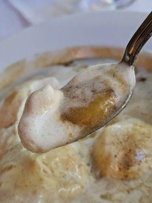 The Banana Foster dessert on a spoon.