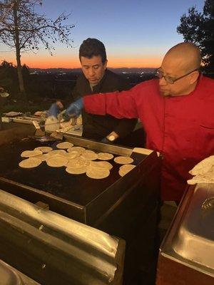 Chef preping the tortillas for the taco bar.