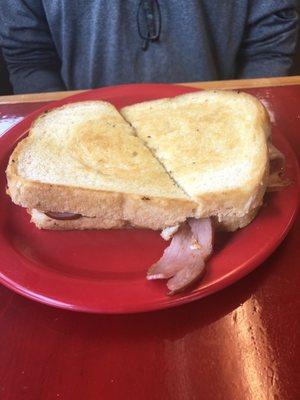 Grilled ham and cheese sandwich on sourdough bread